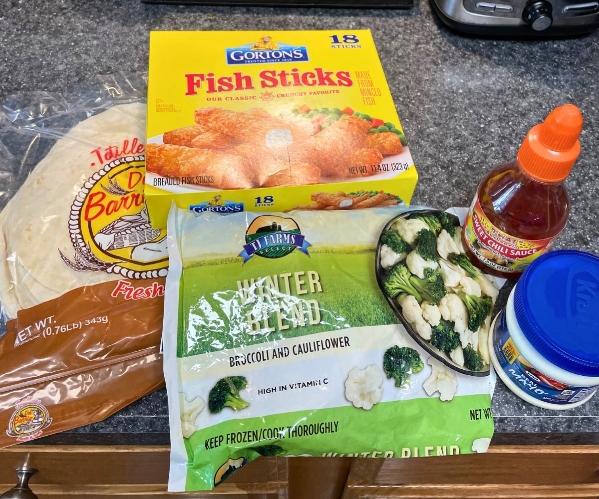 tortillas, fish sticks, and other ingredients on kitchen counter