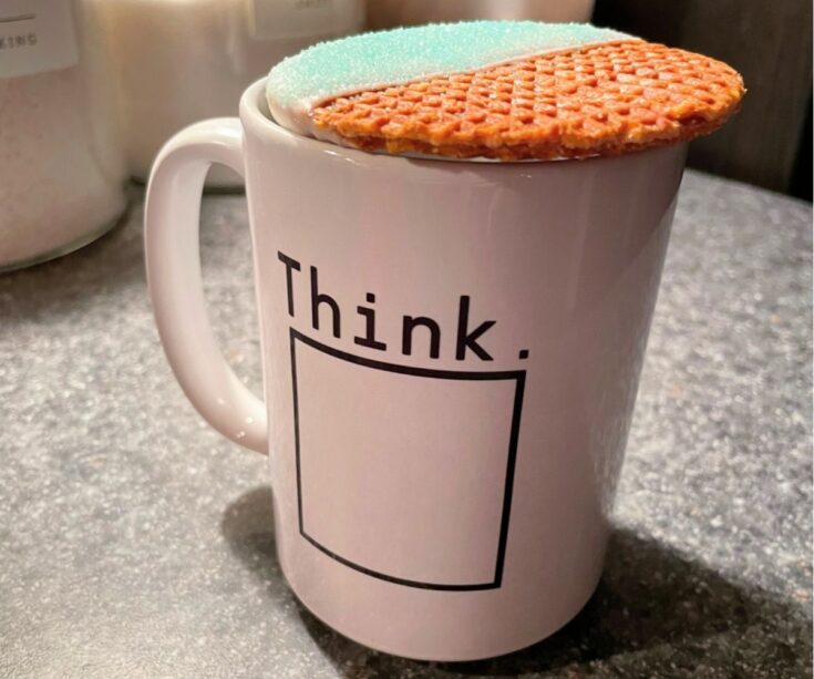 snow-dipped stroopwafel over hot mug