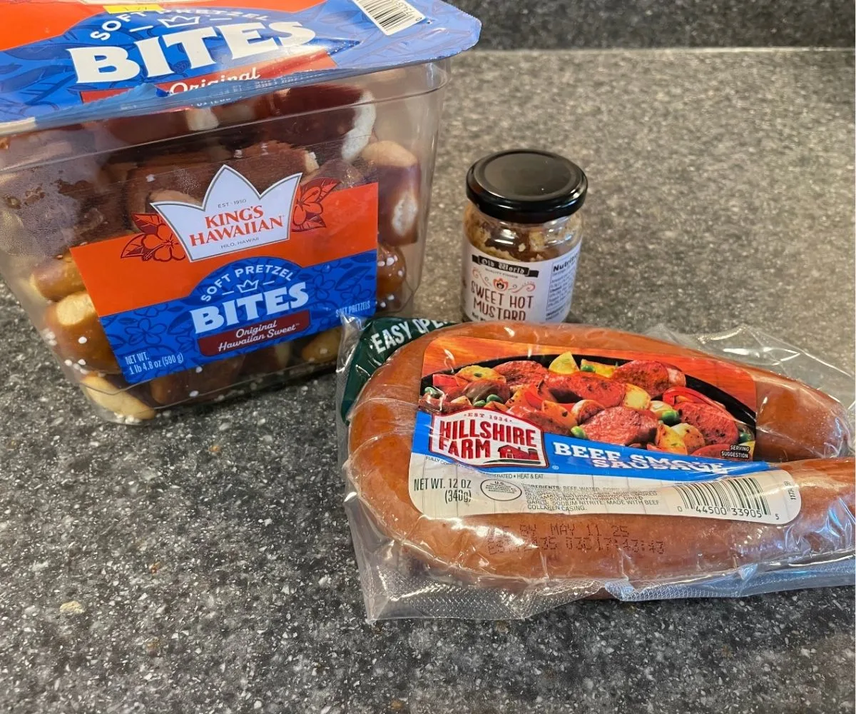 package of precooked beef sausage, sweet hot mustard, and King's Hawaiian Pretzel Bites