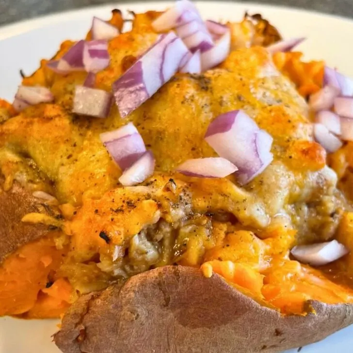 sweet potato stuffed with canned chicken, cheese, bbq sauce, and red onions