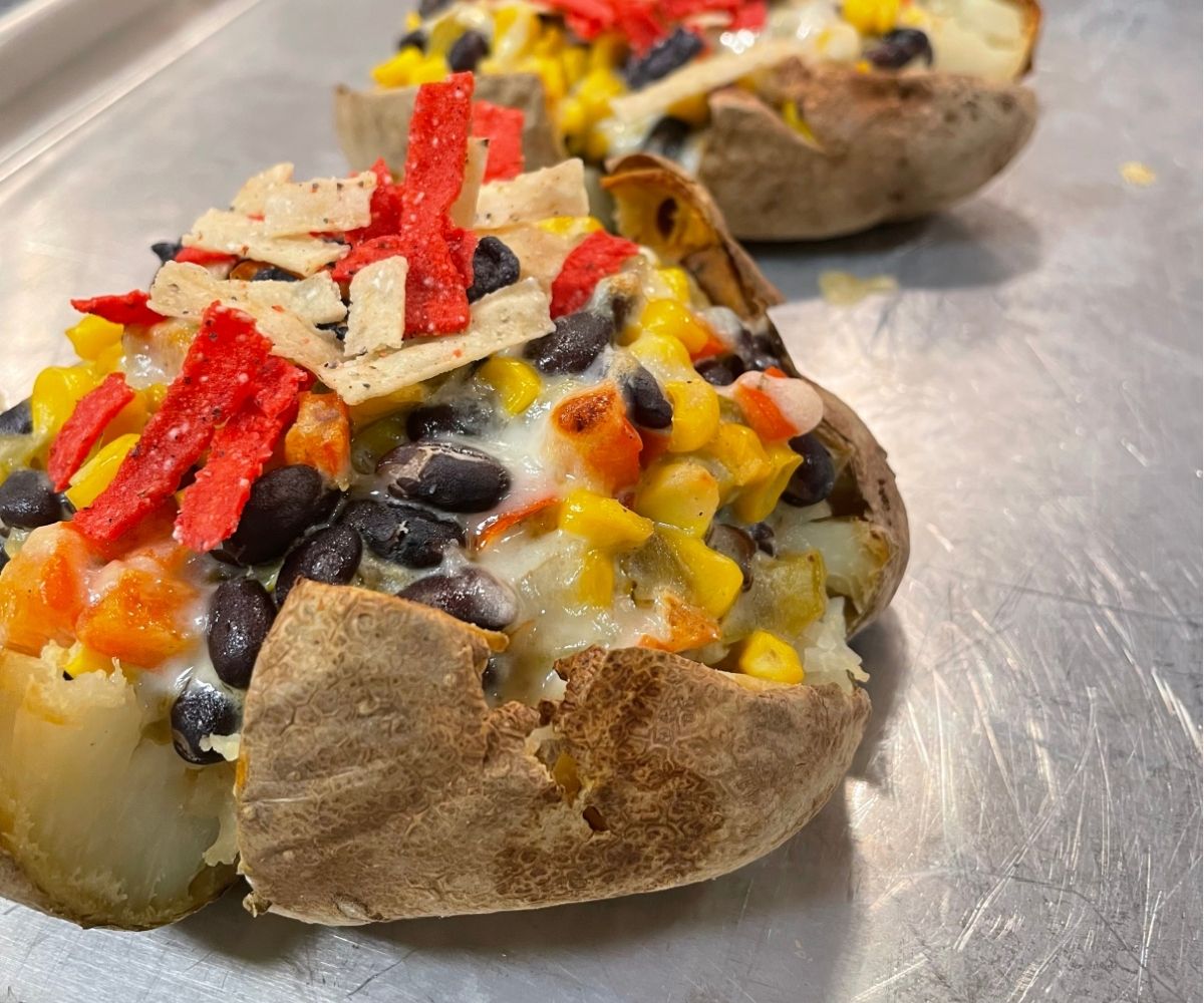 colorful Tex-Mex stuffed baked potatoes on sheet pan