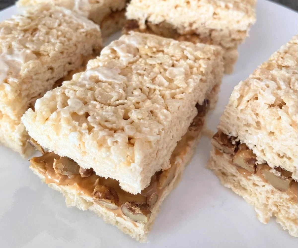 a plate full of stuffed trail mix rice krispies treats