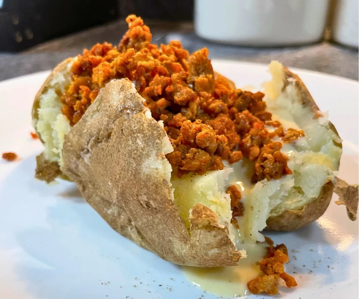cooked chorizo and cheese dip stuffed Baked Potatoes Main Dish on kitchen counter