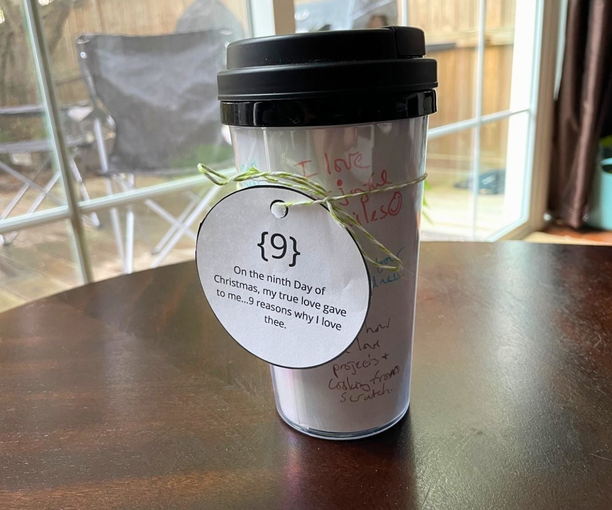 cup put back together with reasons why author loves her husband, tied with ornament shaped tag