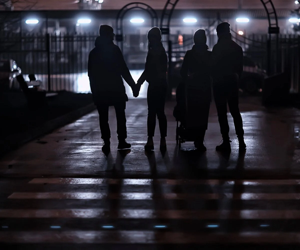 two couples meeting up for a local ghost tour at night