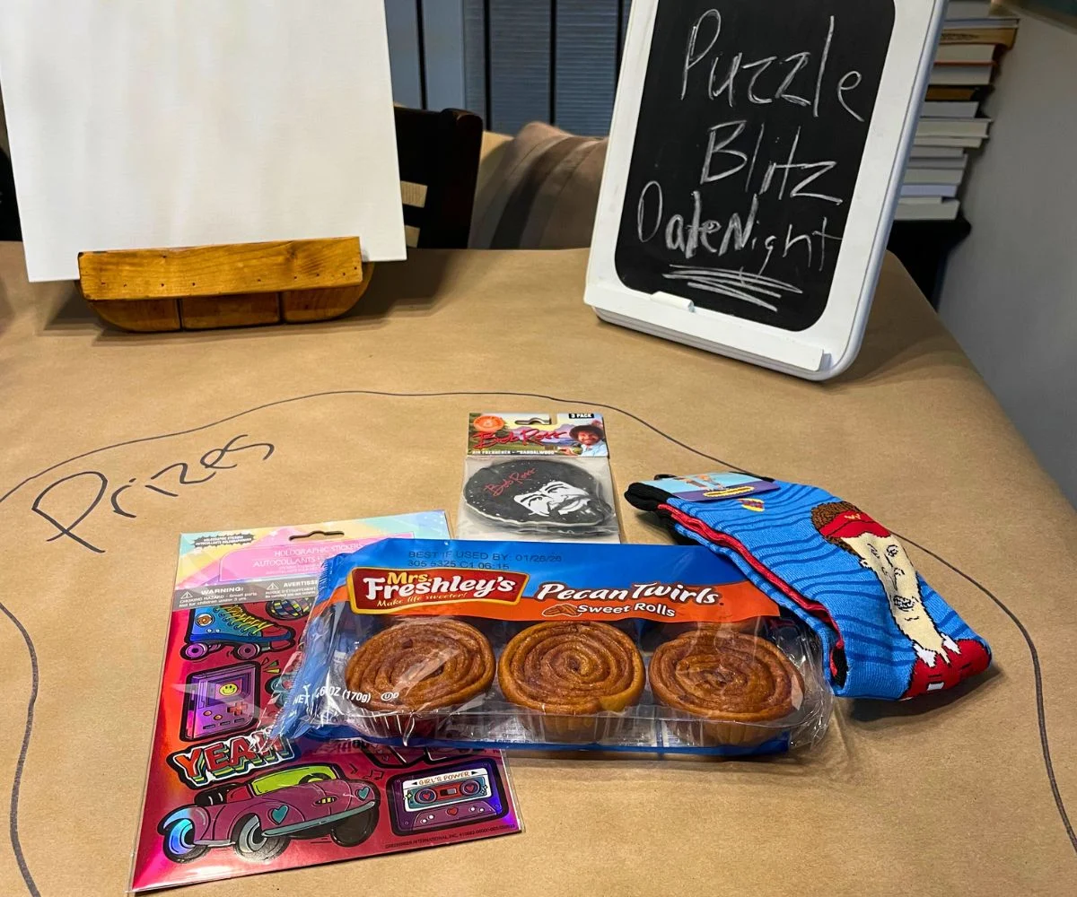 Puzzle Blitz date night prizes on butcher paper