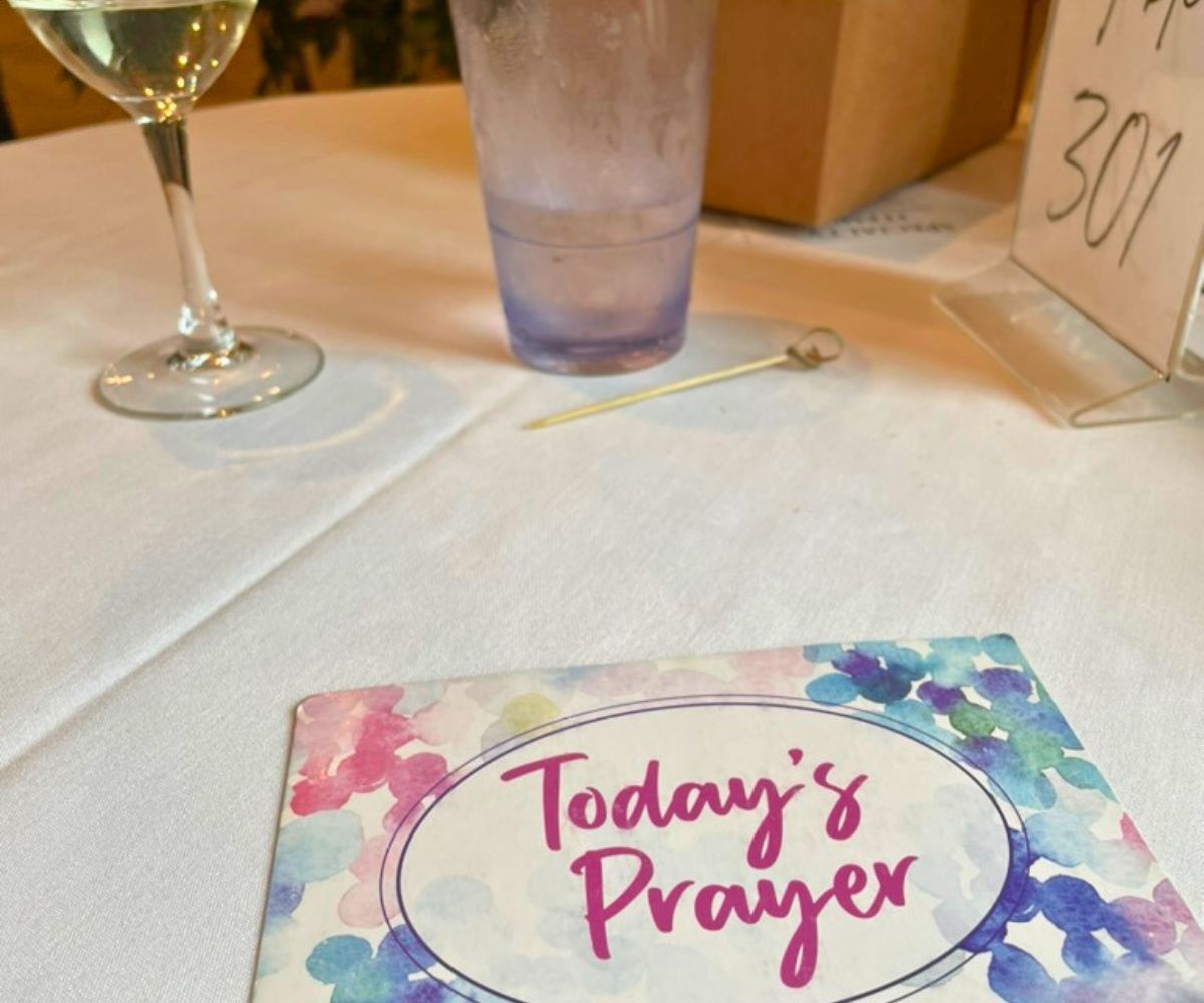 Beautiful prayer card on a restaurant table