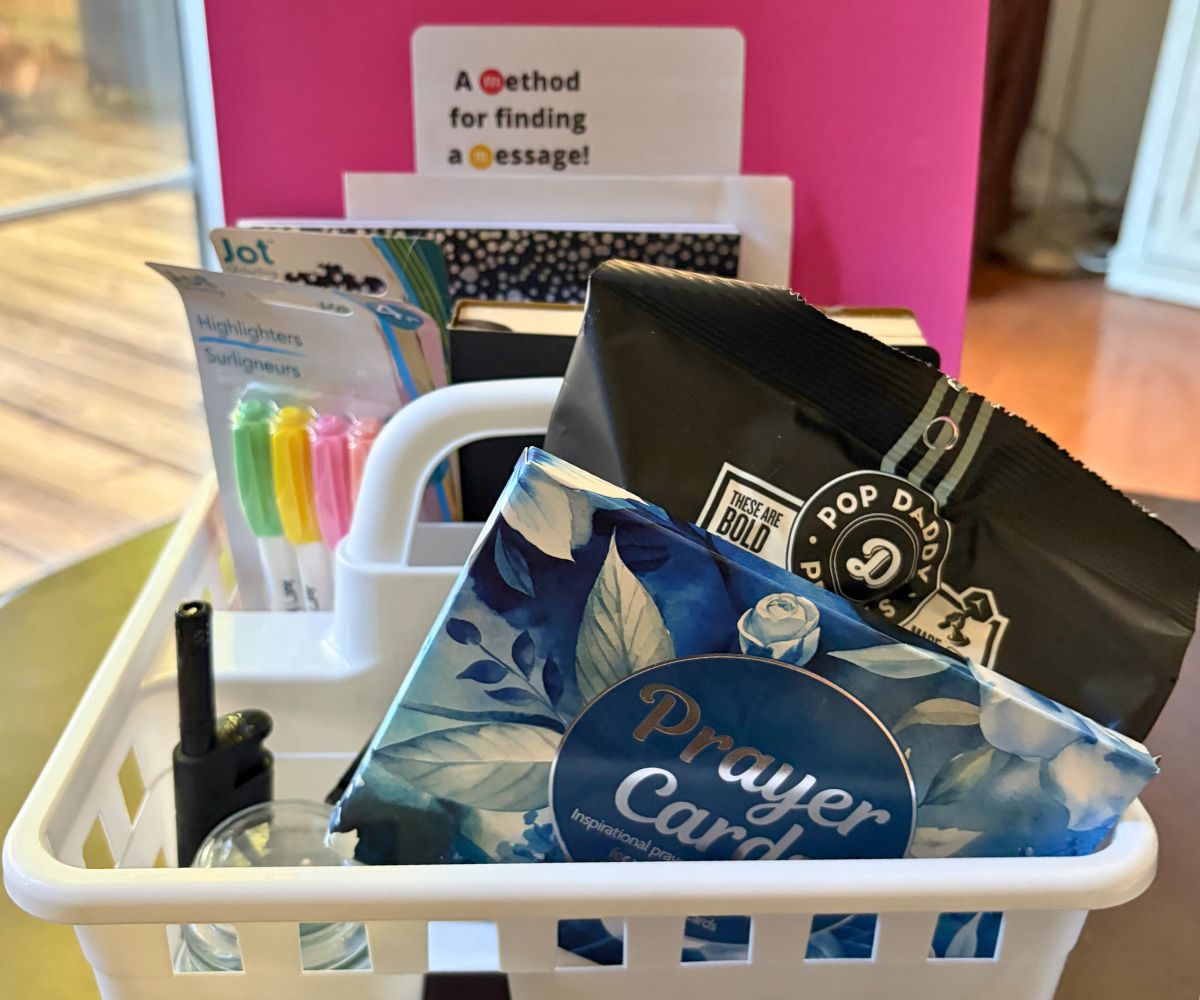 White shower caddy Bible station filled with highlighters, candle and lighter, Prayer cards, a snack, journal, and free printables in back