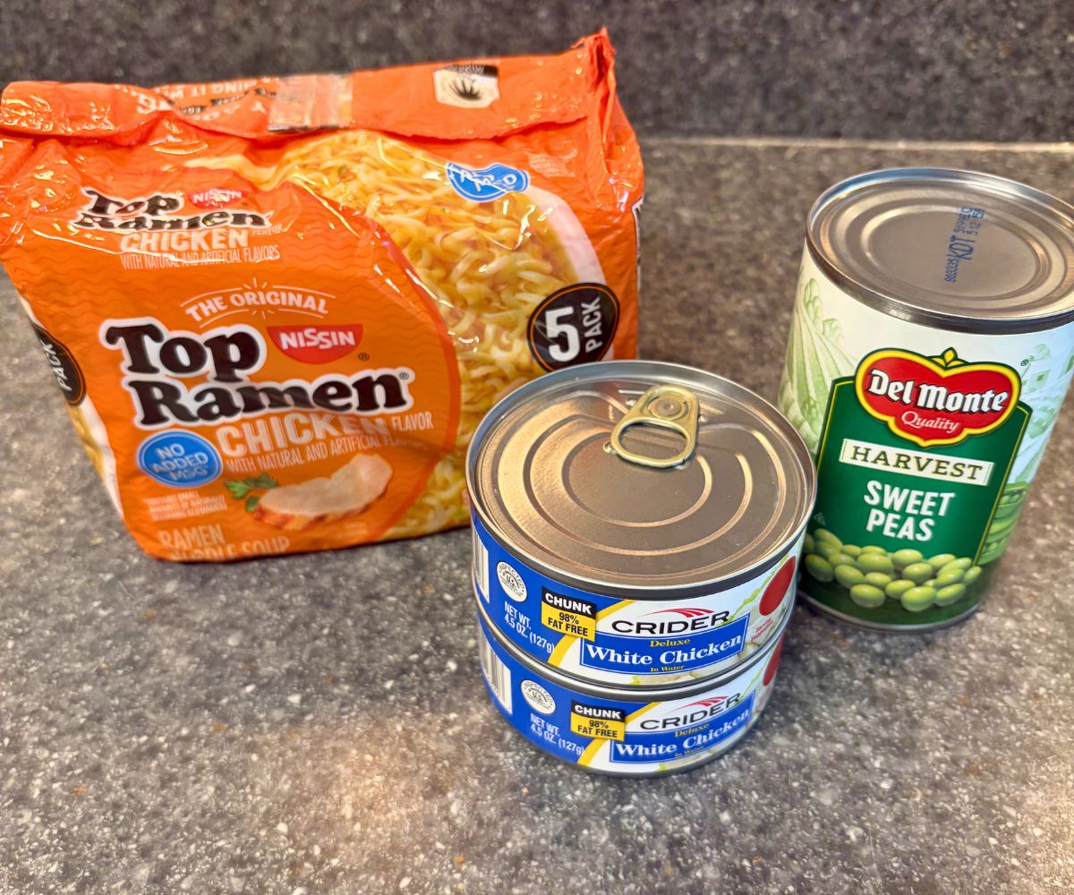 package of ramen, two cans of chicken, and can of sweet peas
