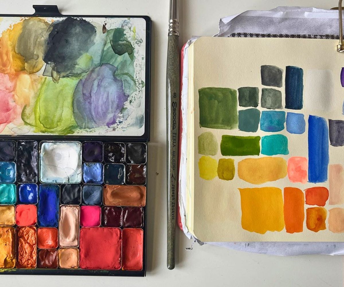 beautiful paint palette of colors on paper and in their holder