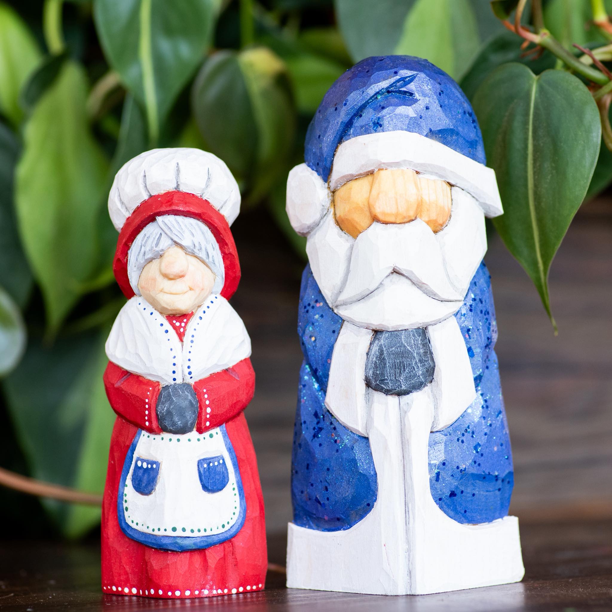 Vibrant, wooden, Mr. and Mrs. Santa Claus in red and blue