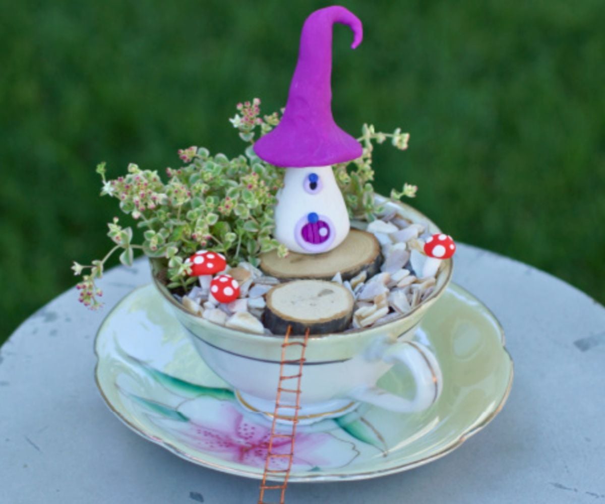 pretty tea cup filled with a mini fairy garden