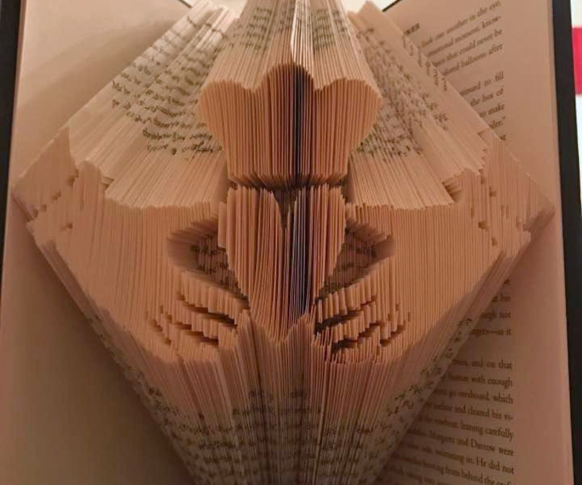 book folded into a Claddagh ring design